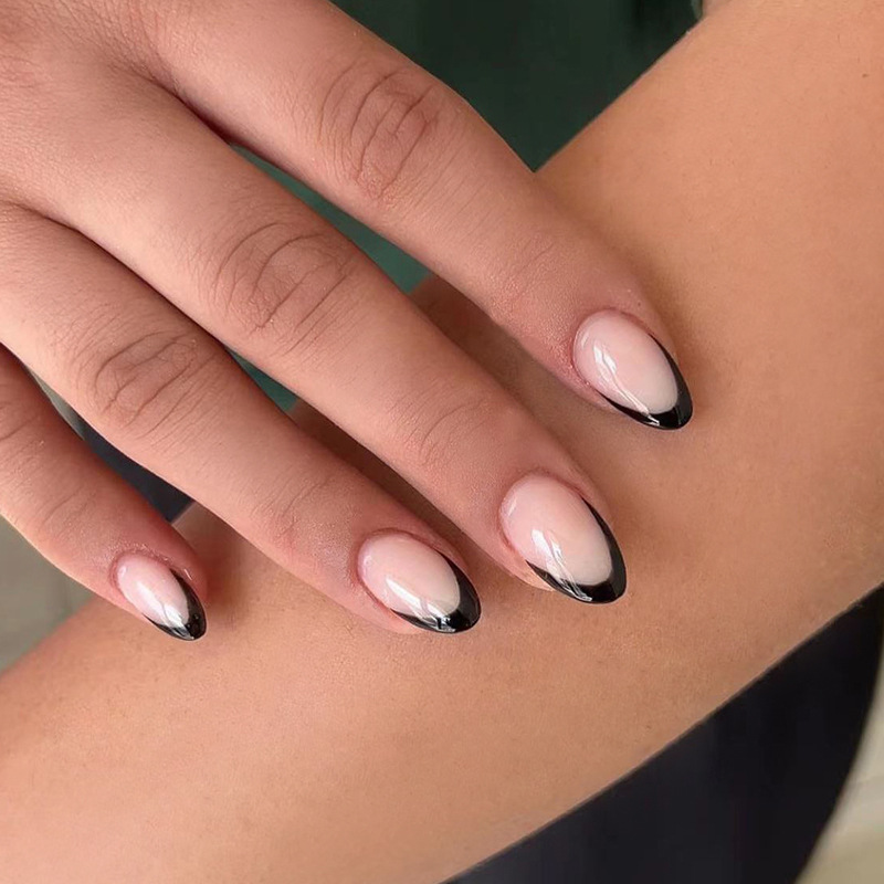Indulge in the classic elegance of black French tip oval short nails from BC OF LOVE Beauty. These chic and sophisticated nails are perfect for any occasion, adding a touch of glamour to your look.